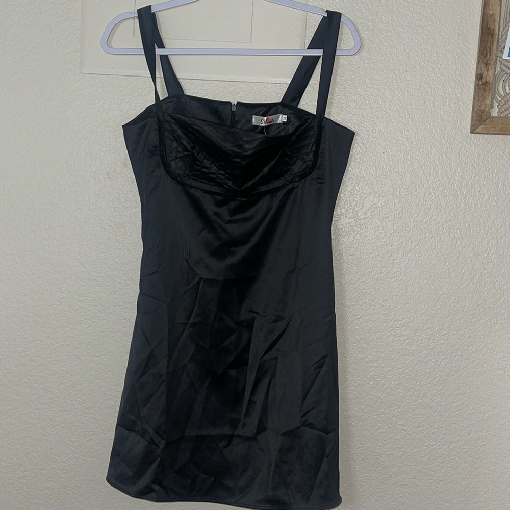This dress is size M from the brand Sthcute, never worn, still new with tags:)!